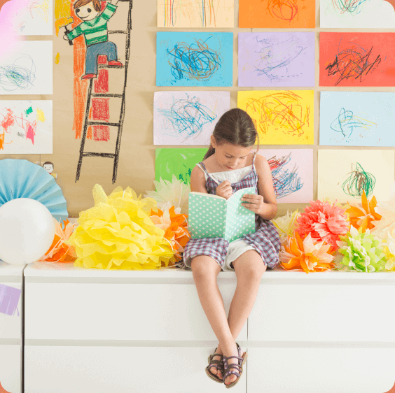 Girl drawing at Midline community in Houston, TX