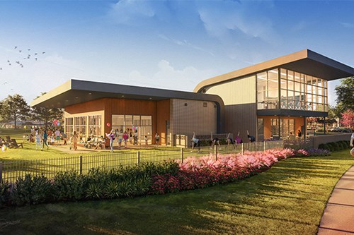 Rendering of The Midline Club, the community gathering spot at Midline, with an event lawn and neighbors outside on a sunny afternoon.